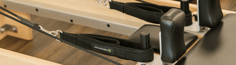 Pilates reformer, tower, chair, and props at Sound Side Pilates